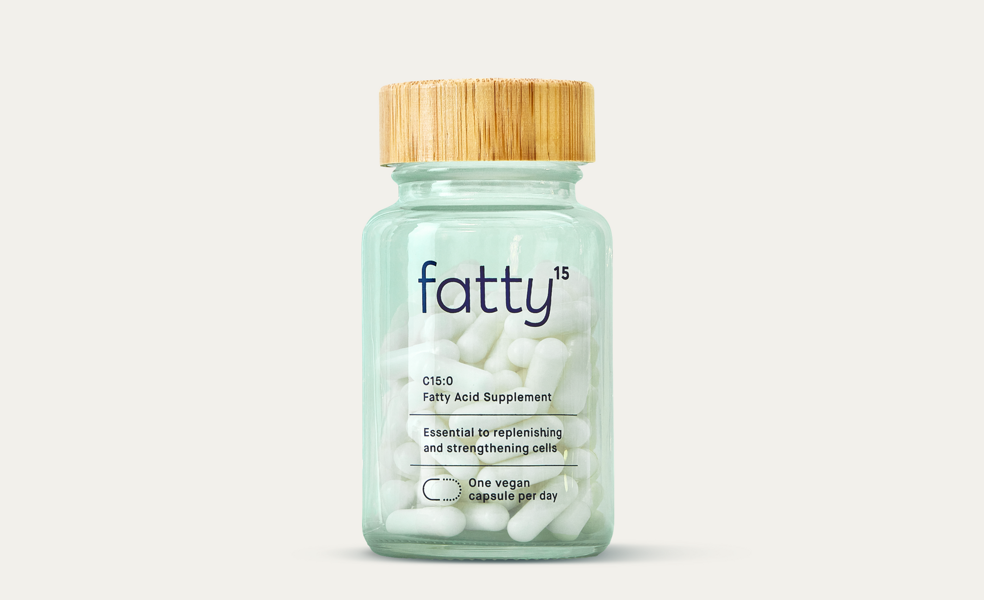 Fatty15's C15 supplement jar with capsules and wood lid.