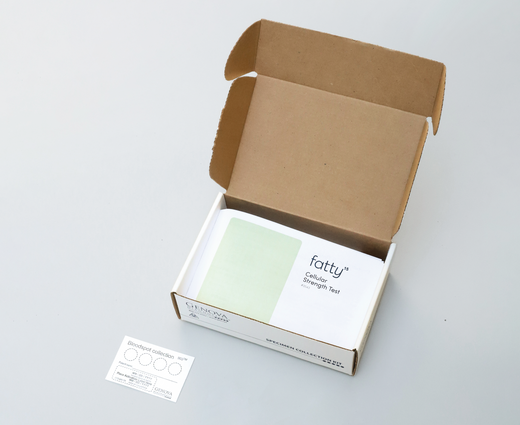 Open box displaying Fatty15's C15 supplement and test kit.