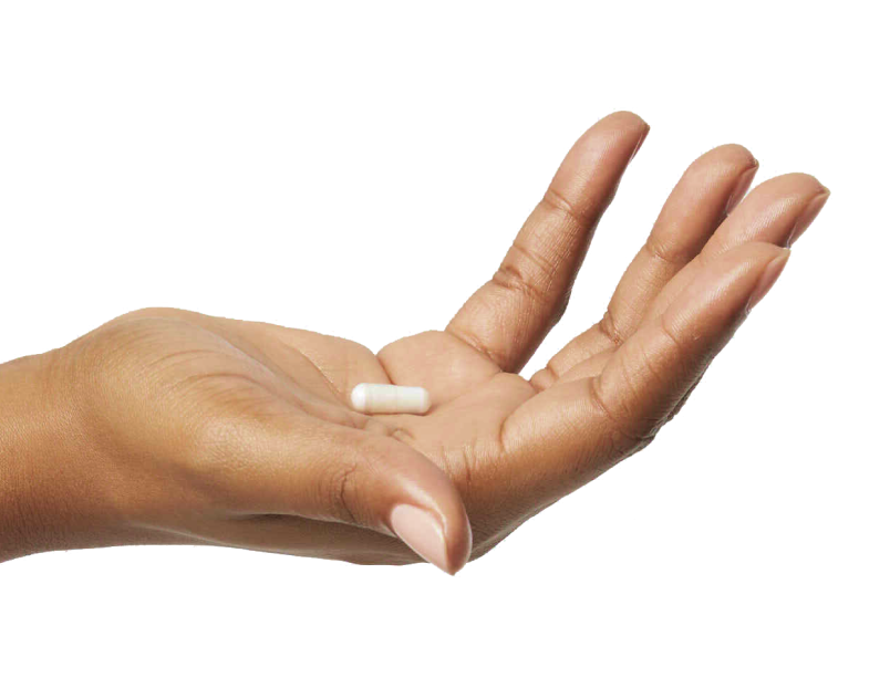 Outstretched hand holding pill